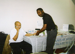Wellness Seminar October 2004. Assemblyman Carl E. Heastie having his cholesterol and glucose levels tested during the Wellness Seminar.